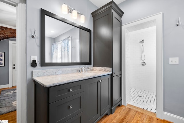 201 W Arlington Ave, Greer, SC 29650 - bathroom with tiled shower, vanity, and wood finished floors