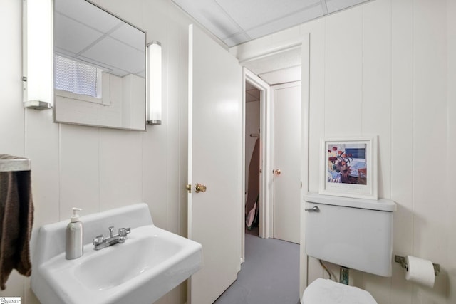 201 W Arlington Ave, Greer, SC 29650 - bathroom featuring a decorative wall, a sink, concrete floors, and toilet