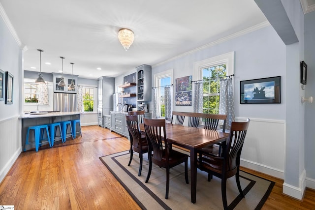 201 W Arlington Ave, Greer, SC 29650 - dining space featuring light wood-type flooring, crown molding, and wainscoting