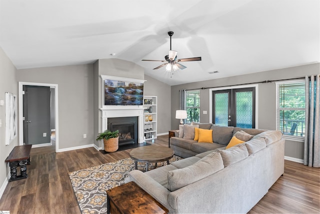 45 Lake Harbor Ct, Greer, SC 29651 - living room with lofted ceiling, baseboards, ceiling fan, wood finished floors, and a fireplace with flush hearth