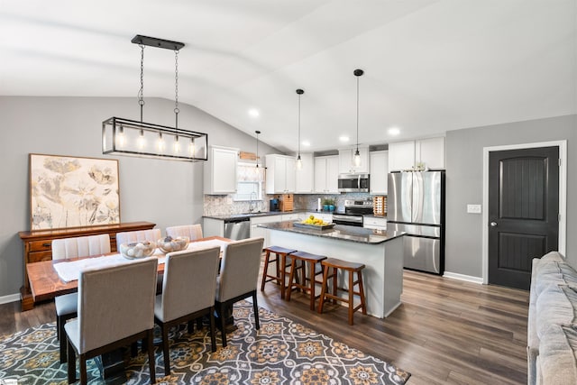45 Lake Harbor Ct, Greer, SC 29651 - dining space with vaulted ceiling, dark wood-style flooring, baseboards, and recessed lighting