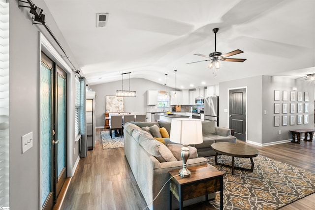 45 Lake Harbor Ct, Greer, SC 29651 - living area featuring vaulted ceiling, wood finished floors, baseboards, ceiling fan, and recessed lighting