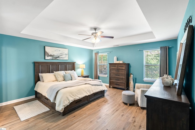 45 Lake Harbor Ct, Greer, SC 29651 - bedroom with a raised ceiling, light wood finished floors, baseboards, and a ceiling fan
