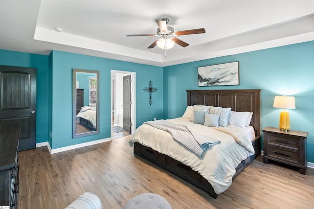 45 Lake Harbor Ct, Greer, SC 29651 - bedroom featuring a raised ceiling, baseboards, and wood finished floors