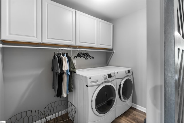 45 Lake Harbor Ct, Greer, SC 29651 - laundry room featuring independent washer and dryer, cabinet space, dark wood-type flooring, and baseboards