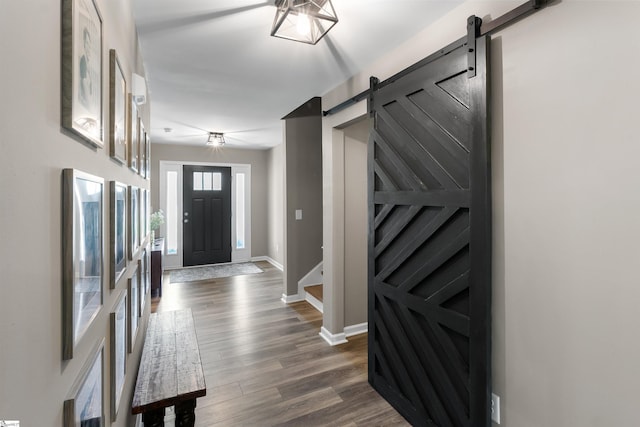 45 Lake Harbor Ct, Greer, SC 29651 - foyer with a barn door, baseboards, and dark wood-style floors