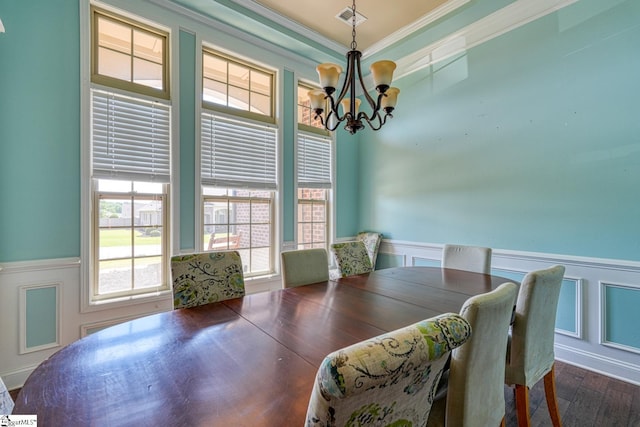 202 Buxton Ct, Easley, SC 29642 - dining room featuring a chandelier, a wainscoted wall, ornamental molding, dark wood-style floors, and a decorative wall