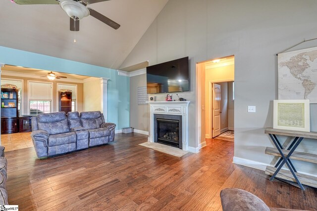 202 Buxton Ct, Easley, SC 29642 - living area with a ceiling fan, high vaulted ceiling, wood finished floors, a fireplace with flush hearth, and ornate columns