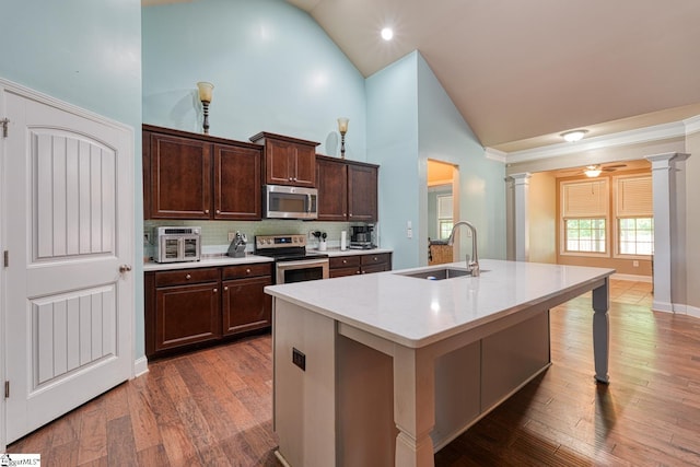 202 Buxton Ct, Easley, SC 29642 - kitchen with stainless steel appliances, ornate columns, high vaulted ceiling, a sink, and decorative backsplash