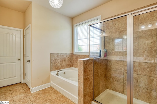 202 Buxton Ct, Easley, SC 29642 - full bath with a garden tub, a stall shower, tile patterned flooring, and baseboards