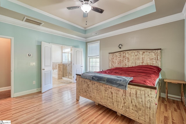 202 Buxton Ct, Easley, SC 29642 - bedroom with light wood-style flooring, a raised ceiling, crown molding, baseboards, and connected bathroom