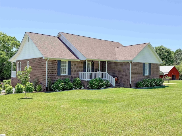 6050 Cross Anchor Rd, Enoree, SC 29335 - ranch-style home featuring covered porch, brick siding, a front lawn, and roof with shingles