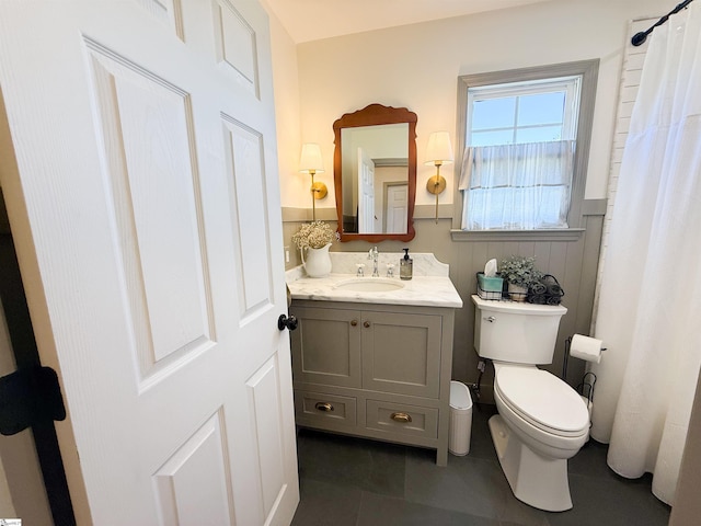 6050 Cross Anchor Rd, Enoree, SC 29335 - bathroom with toilet, a wainscoted wall, vanity, tile patterned flooring, and curtained shower
