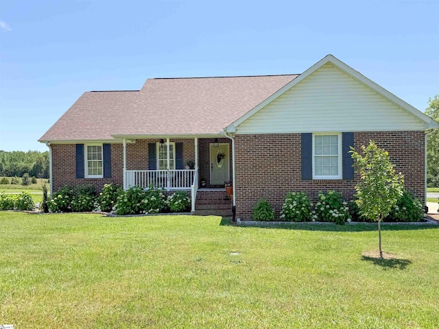 6050 Cross Anchor Rd, Enoree, SC 29335 - view of front of property featuring covered porch, brick siding, and a front lawn