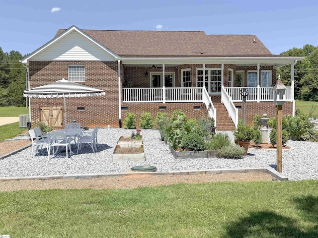 6050 Cross Anchor Rd, Enoree, SC 29335 - rear view of property with brick siding, a patio, central AC unit, stairs, and a lawn