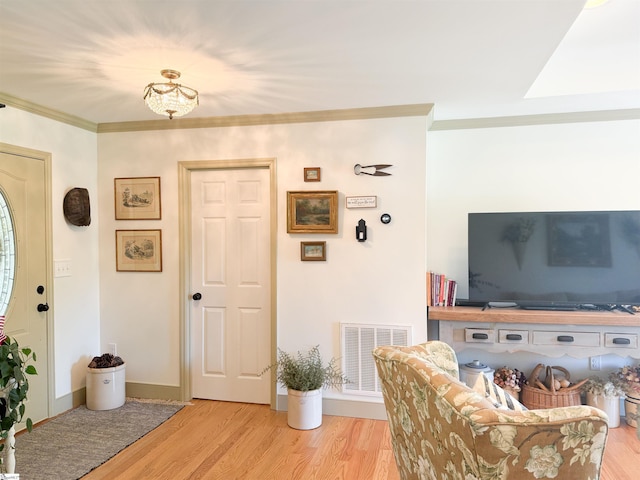 6050 Cross Anchor Rd, Enoree, SC 29335 - living area featuring wood finished floors, crown molding, and baseboards