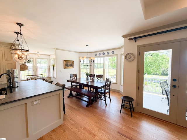6050 Cross Anchor Rd, Enoree, SC 29335 - dining area featuring a chandelier, light wood-style flooring, healthy amount of natural light, and ornamental molding