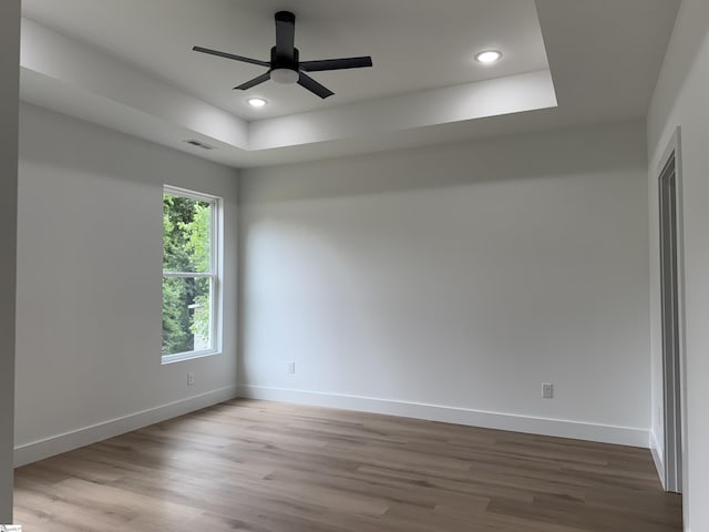 1623 Fairfield Rd, Chesnee, SC 29323 - unfurnished room featuring wood finished floors, a raised ceiling, a ceiling fan, baseboards, and recessed lighting