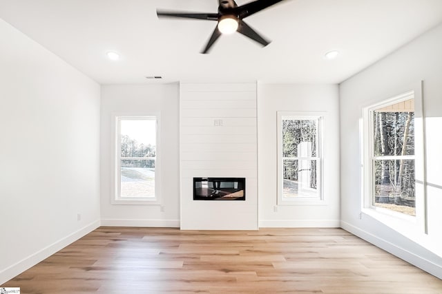 1623 Fairfield Rd, Chesnee, SC 29323 - unfurnished living room with light wood finished floors, baseboards, a large fireplace, a ceiling fan, and recessed lighting