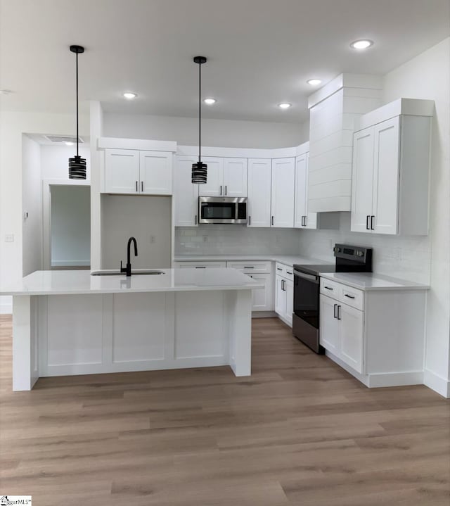 1623 Fairfield Rd, Chesnee, SC 29323 - kitchen featuring stainless steel appliances, a sink, a kitchen island with sink, white cabinetry, and recessed lighting