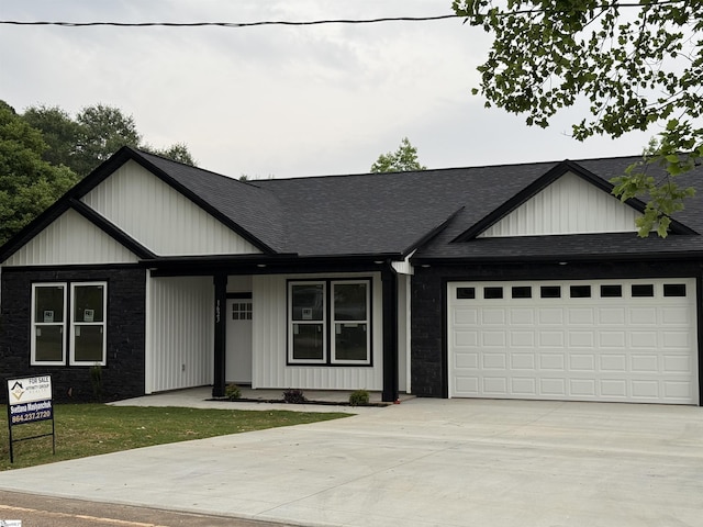 1623 Fairfield Rd, Chesnee, SC 29323 - view of front of property with concrete driveway, a shingled roof, an attached garage, and board and batten siding
