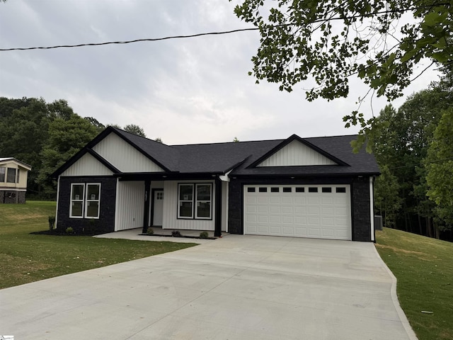 1623 Fairfield Rd, Chesnee, SC 29323 - modern farmhouse style home featuring an attached garage, concrete driveway, a front yard, and board and batten siding