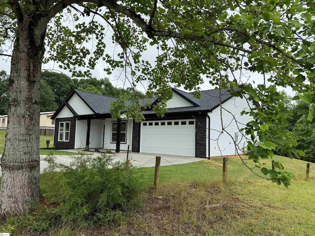 1623 Fairfield Rd, Chesnee, SC 29323 - view of front facade featuring a front yard, a garage, driveway, and a shingled roof