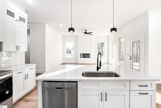 136 Susans Rd, Gaffney, SC 29341 - kitchen featuring appliances with stainless steel finishes, a sink, ceiling fan, light countertops, and light wood finished floors