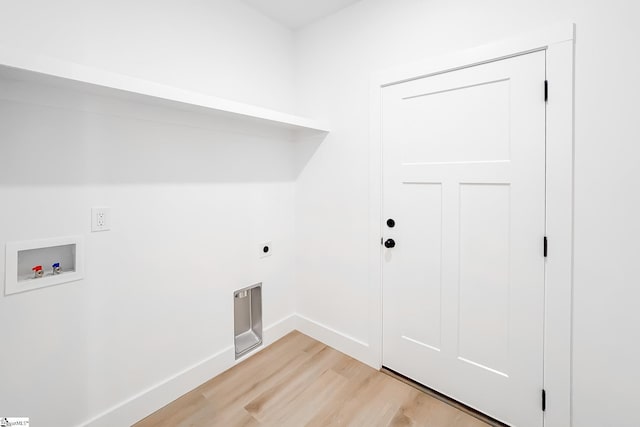 136 Susans Rd, Gaffney, SC 29341 - laundry room with light wood-style flooring, hookup for a washing machine, hookup for an electric dryer, and baseboards