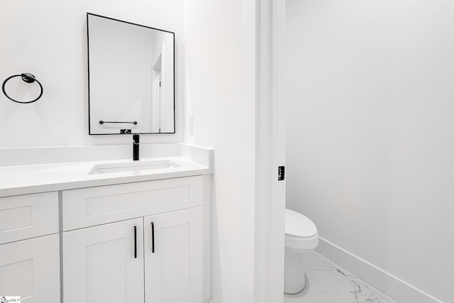136 Susans Rd, Gaffney, SC 29341 - bathroom featuring marble look tiles, baseboards, toilet, and vanity