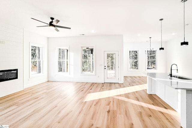 136 Susans Rd, Gaffney, SC 29341 - unfurnished living room featuring a sink, light wood-style floors, healthy amount of natural light, recessed lighting, and a ceiling fan