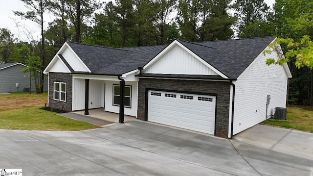 136 Susans Rd, Gaffney, SC 29341 - view of front of property with driveway, covered porch, a garage, stone siding, and board and batten siding