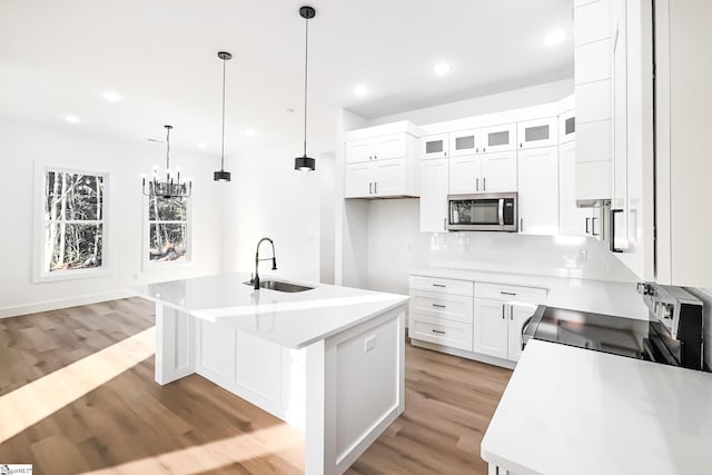 136 Susans Rd, Gaffney, SC 29341 - kitchen with a sink, stainless steel appliances, light wood-style flooring, an island with sink, and recessed lighting
