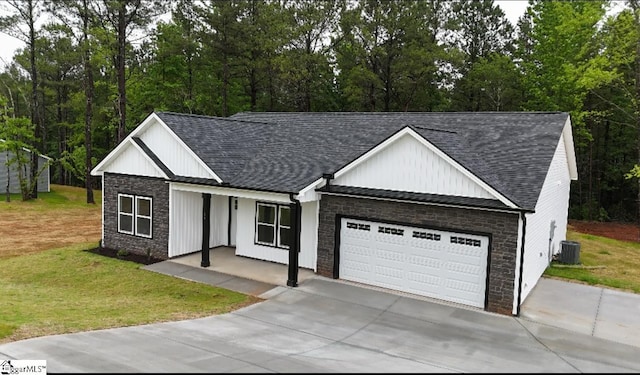 136 Susans Rd, Gaffney, SC 29341 - modern farmhouse with roof with shingles, an attached garage, board and batten siding, a front yard, and central AC unit