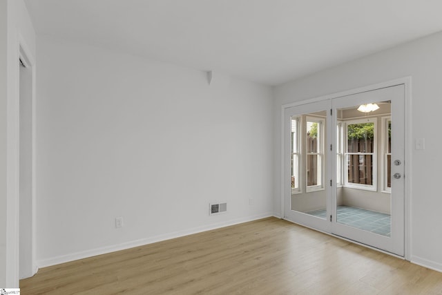 528 Market St, Spartanburg, SC 29301 - empty room with light wood-style floors and baseboards