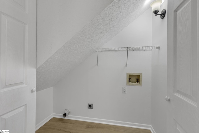 528 Market St, Spartanburg, SC 29301 - laundry room with hookup for a washing machine, electric dryer hookup, wood finished floors, baseboards, and a textured ceiling