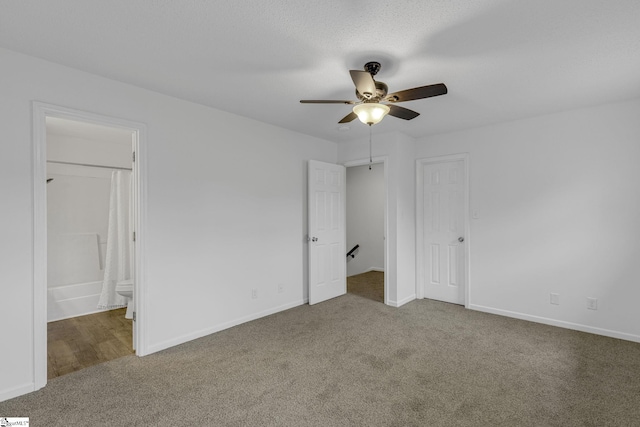 528 Market St, Spartanburg, SC 29301 - unfurnished bedroom with carpet flooring, baseboards, ensuite bathroom, and a ceiling fan