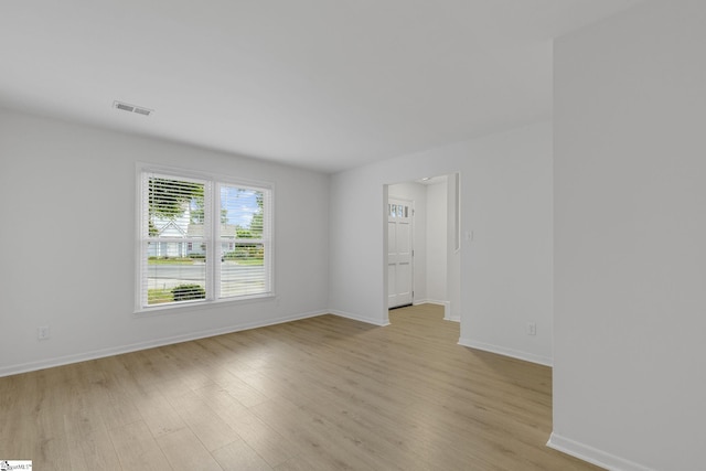 528 Market St, Spartanburg, SC 29301 - spare room featuring light wood-type flooring and baseboards