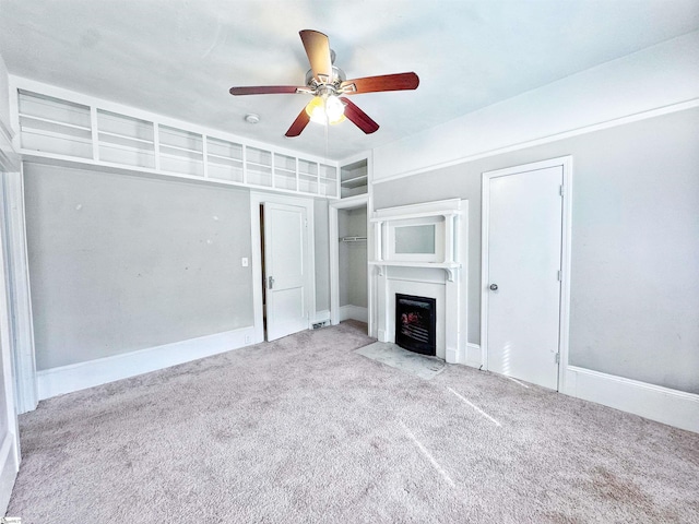203 Arlington Rd, Greer, SC 29651 - unfurnished living room featuring carpet, a fireplace with flush hearth, ceiling fan, and baseboards