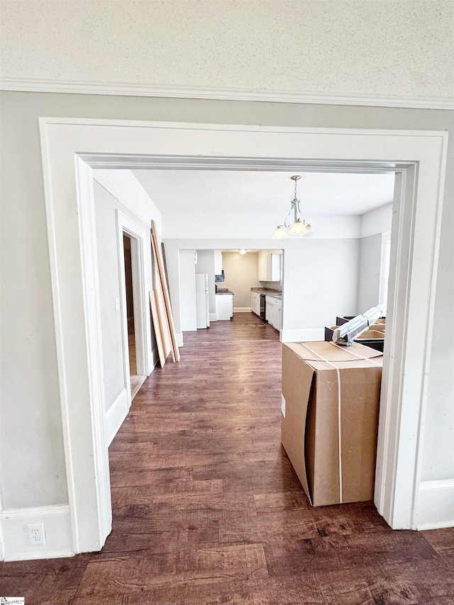 203 Arlington Rd, Greer, SC 29651 - hall featuring dark wood-type flooring and a chandelier
