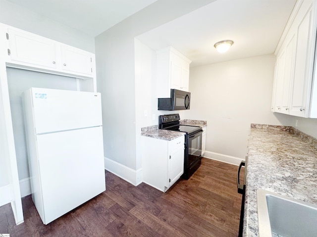 203 Arlington Rd, Greer, SC 29651 - kitchen with black appliances, dark wood-style floors, baseboards, and white cabinets