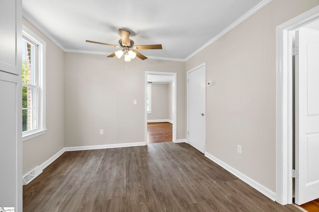 202 E Green St, Iva, SC 29655 - unfurnished room featuring dark wood-style floors, a ceiling fan, crown molding, and baseboards