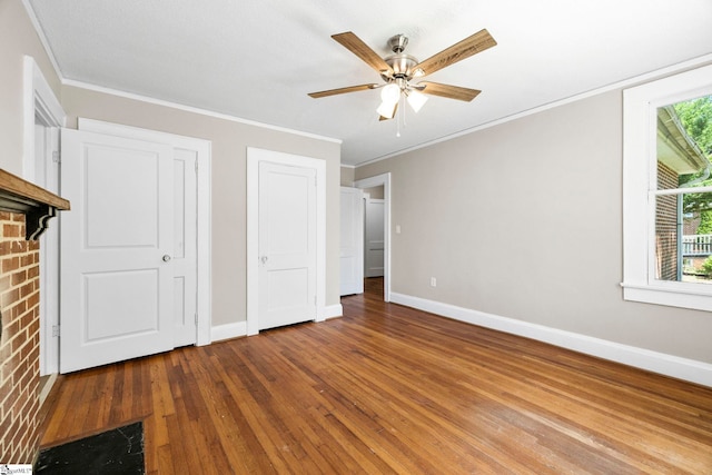 202 E Green St, Iva, SC 29655 - unfurnished bedroom with baseboards, crown molding, wood finished floors, and ceiling fan