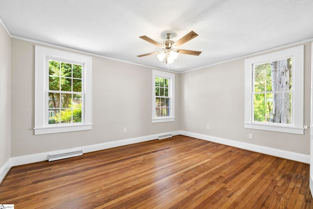 202 E Green St, Iva, SC 29655 - spare room featuring hardwood / wood-style flooring, ornamental molding, baseboards, and a ceiling fan