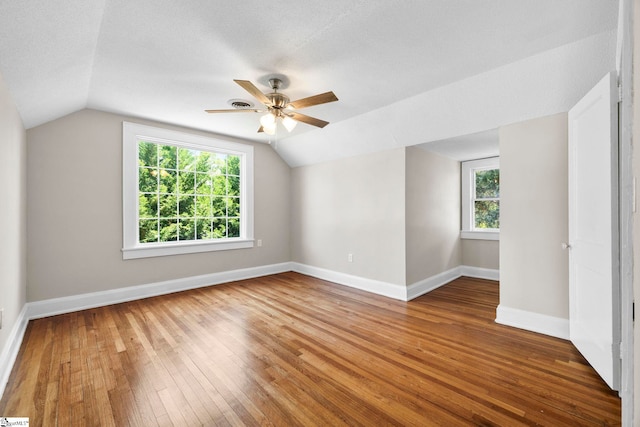 202 E Green St, Iva, SC 29655 - spare room featuring lofted ceiling, hardwood / wood-style flooring, ceiling fan, and baseboards
