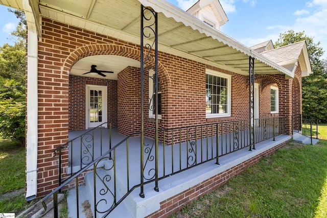 202 E Green St, Iva, SC 29655 - property entrance featuring ceiling fan, brick siding, and a porch
