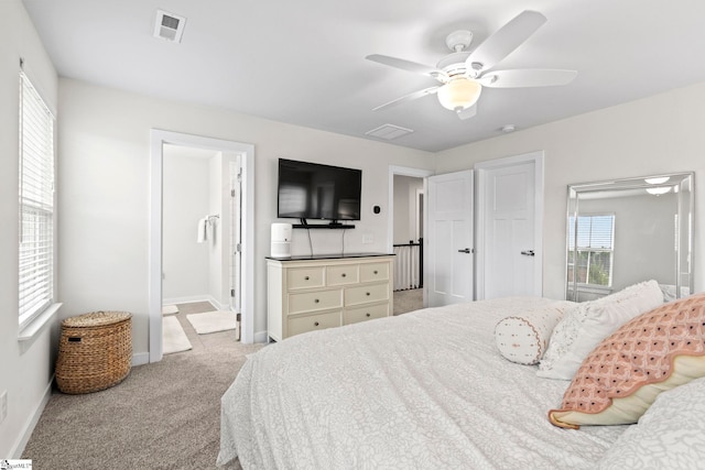 311 Sandusky Ln, Simpsonville, SC 29680 - carpeted bedroom featuring baseboards, a ceiling fan, and ensuite bathroom