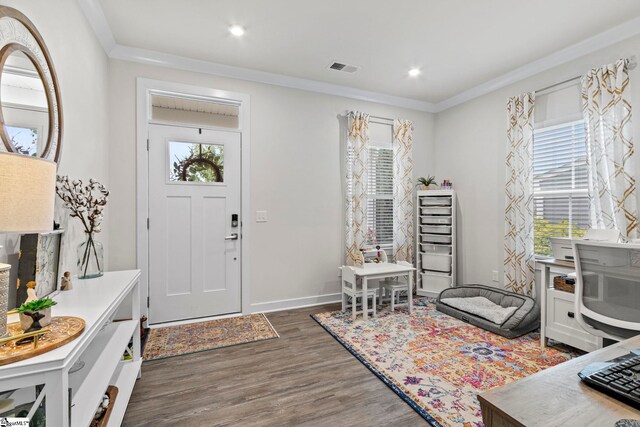 311 Sandusky Ln, Simpsonville, SC 29680 - foyer with plenty of natural light, wood finished floors, ornamental molding, recessed lighting, and baseboards