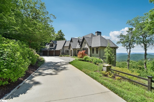 1110 Mountain Summit Rd, Travelers Rest, SC 29690 - view of front of house featuring driveway, a garage, a chimney, and a mountain view