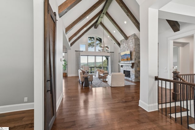 1110 Mountain Summit Rd, Travelers Rest, SC 29690 - living room with beamed ceiling, hardwood / wood-style flooring, a fireplace, high vaulted ceiling, and baseboards